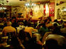 Patrons enjoying live folk music at Boliche de Balderrama.
