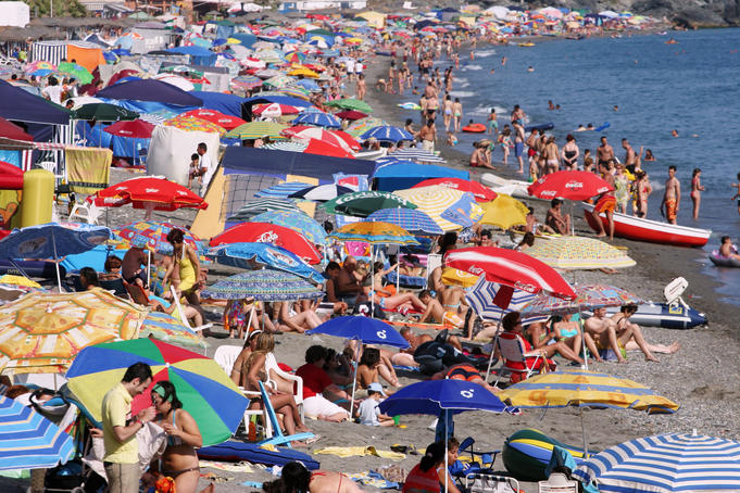 People enjoying the beach during the Festival of San Juan.