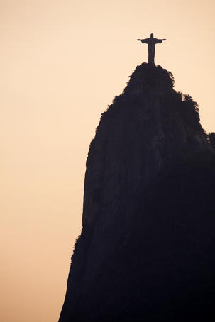 Silhouette of Cristo Redentor (Christ the Redeemer) statue on the summit of Corcovado.