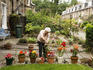 Gardener in Teviotdale Place in Stockbridge Colonies off Glenogle Road, New Town.