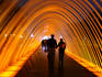People walking through one of the 13 illuminated fountains at Lima's Parque de la Reserva