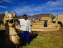 Man with boat, Uros Island, Lake Titicaca, Puno