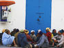 Group of people sitting in the Medina.