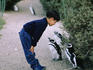 A young boy and a couple of Magellanic or jackass Penguins (Spheniscus magellanicus) get to know each other in Punta Tombo
