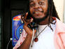 Belizean making a phone call.