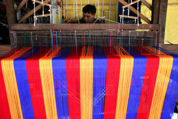 Man weaving cloth.
