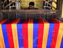 Man weaving cloth.