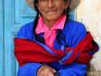 Local woman sitting on doorstep, Yanama village.