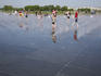 People enjoying the sprays of mist at Miroir d'eau des quais.