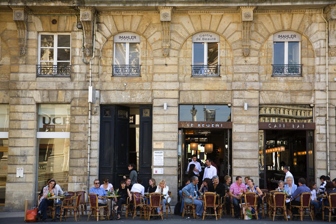People sitting an outdoor cafe.