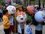 Children with paper mache heads, annual Raval festivities.