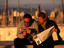 Couple consulting 'Lonely Planet' Barcelona guide.