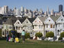 The Painted Ladies victorian houses and city skyline at Alamo Square.