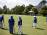 Playing croquet in park.