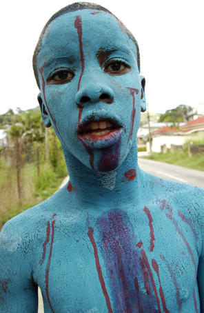 Portrait of boy in make-up at Saturday Kiddies Carnival Competitions parade.