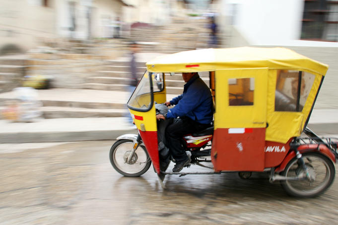 Mototaxi driving in the city center, Cajamarca