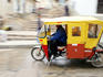 Mototaxi driving in the city center, Cajamarca