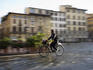 Cyclist crossing Piazza della Signoria.