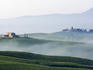 Fog over hills of Val d'Orcia.