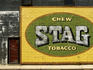 Stag tobacco sign on wall.