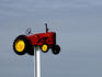 Tractor mounted on pole.