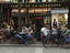 People relaxing in cafe on Place de la Sorbonne Square in the St-Germain area.