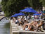 Sunbathers on banks of River Siene at the Paris Plage (Paris beach).