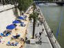 Sunbathers on banks of River Siene at the Paris Plage (Paris beach).