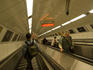 People riding on escalator in the Budapest Metro.