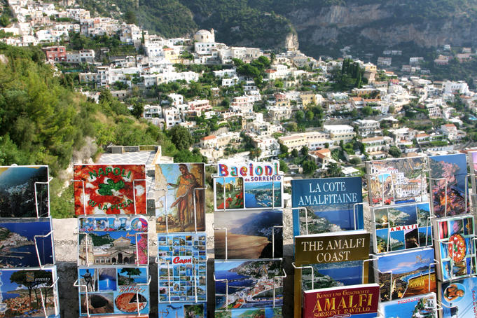 Postcards and souvenirs for sale, overlooking town on Amalfi Coast.