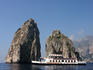 Ferry sailing past I Faraglioni, Island of Capri.
