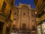 Cathedral at dusk, seen from city alley.