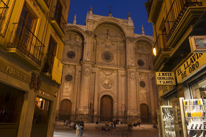 Cathedral at dusk, seen from city alley, Granada