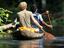 Tourist and guide paddling canoe on Rio Samiria.