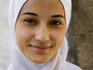 Portrait of a young woman wearing headscarf.