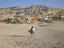 Two boys riding on a donkey in Luxor.