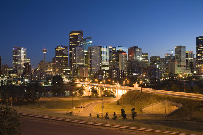 Skyline of Downtown Calgary, with Lions Bridge, at night.