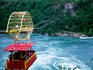 Whirpool Aero Car soaring above the Niagara River, below Niagara falls.