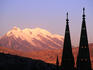 Illimani at sunset, with silhouetted spires.
