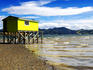 Wooden boathouse at end of pier, Otago Harbour.