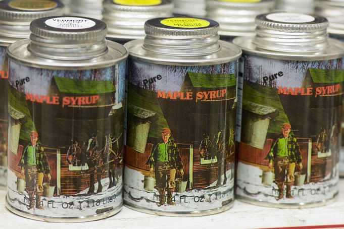 Maple syrup cans at Vermont Country Store.
