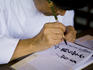 Woman writing calligraphy, Kyoto Handicrafts Centre.
