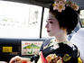 Young maiko (apprentice geisha) girl in a taxi.