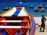 Brightly-painted boats on Playa Manzanillo.