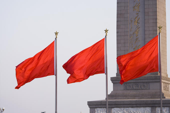 Flags fly before the Monument to the Peoples' Heroes, Tiananmen Square, Dongcheng district.