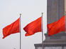 Flags fly before the Monument to the Peoples' Heroes, Tiananmen Square, Dongcheng district.