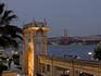 Palace Gate of the Ciragan Palace, with the Bosphorus Bridge spanning the Bosphorus Strait.