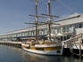 Somerset on the Pier apartments, with restored square-rigger Lady Nelson moored at Elizabeth Pier.