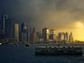 Ferry and Hong Kong Island waterfront with skyscrapers.
