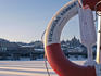Frozen river and lifesaver ring, winter.